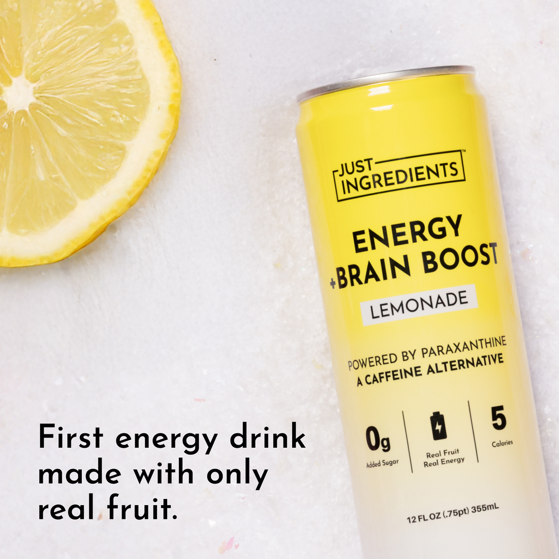 Single yellow Lemonade Energy + Brain Boost can next to a lemon slice on a light background.