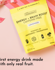 Yellow pouch labeled "Energy + Brain Boost Lemonade" with illustrations and text about ingredients and servings.