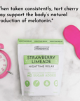 Strawberry Limeade Nighttime Relax pouch with pink alarm clock and sleep mask on marble surface.