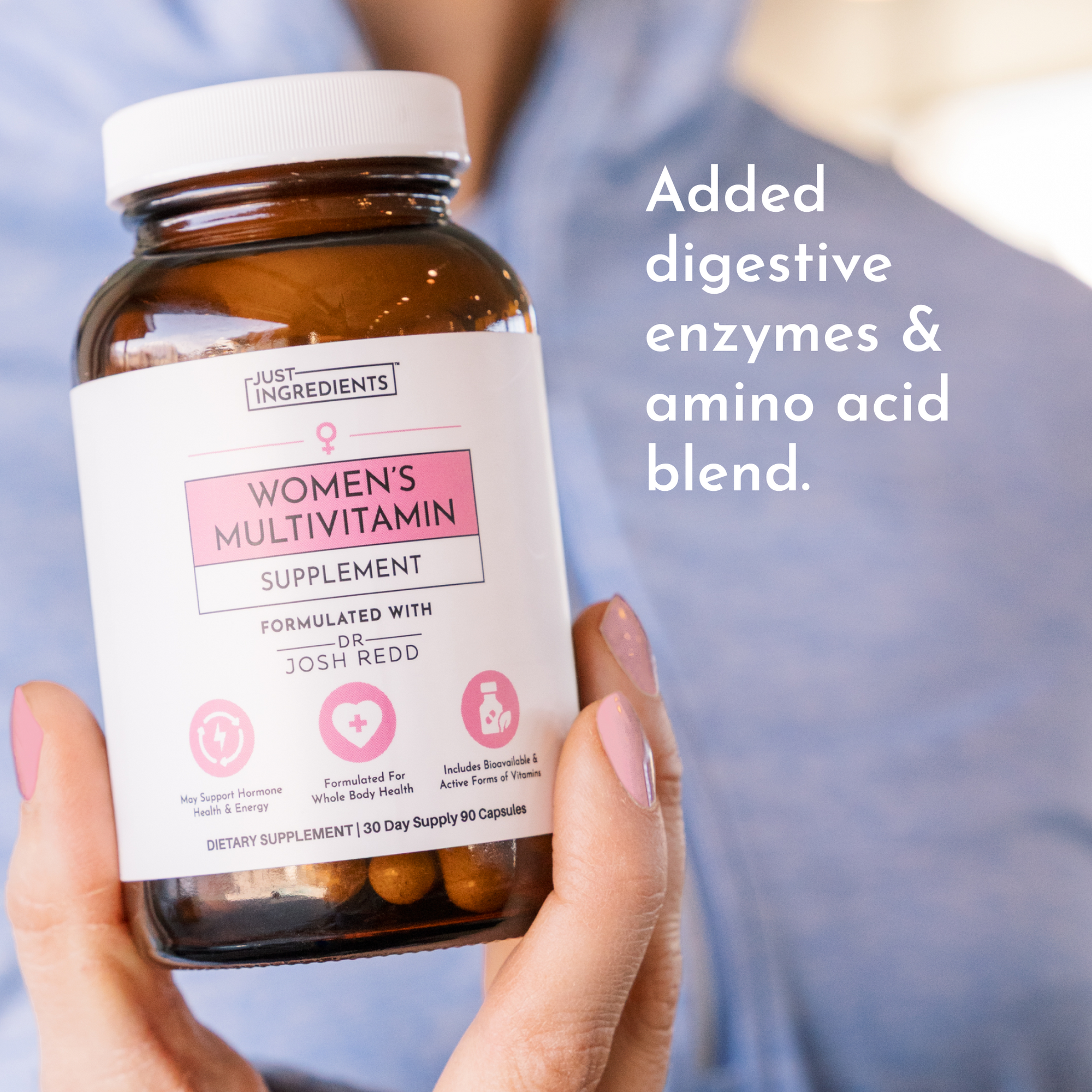 Brown bottle of women's multivitamin supplement with a white cap, held in a hand, showing capsules inside.