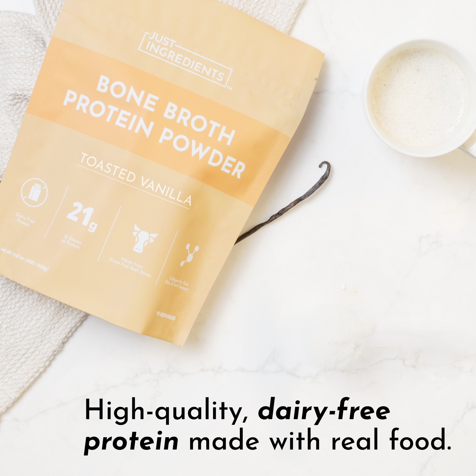 Packaging of toasted vanilla bone broth protein powder with a cup of blended powder and a vanilla bean.