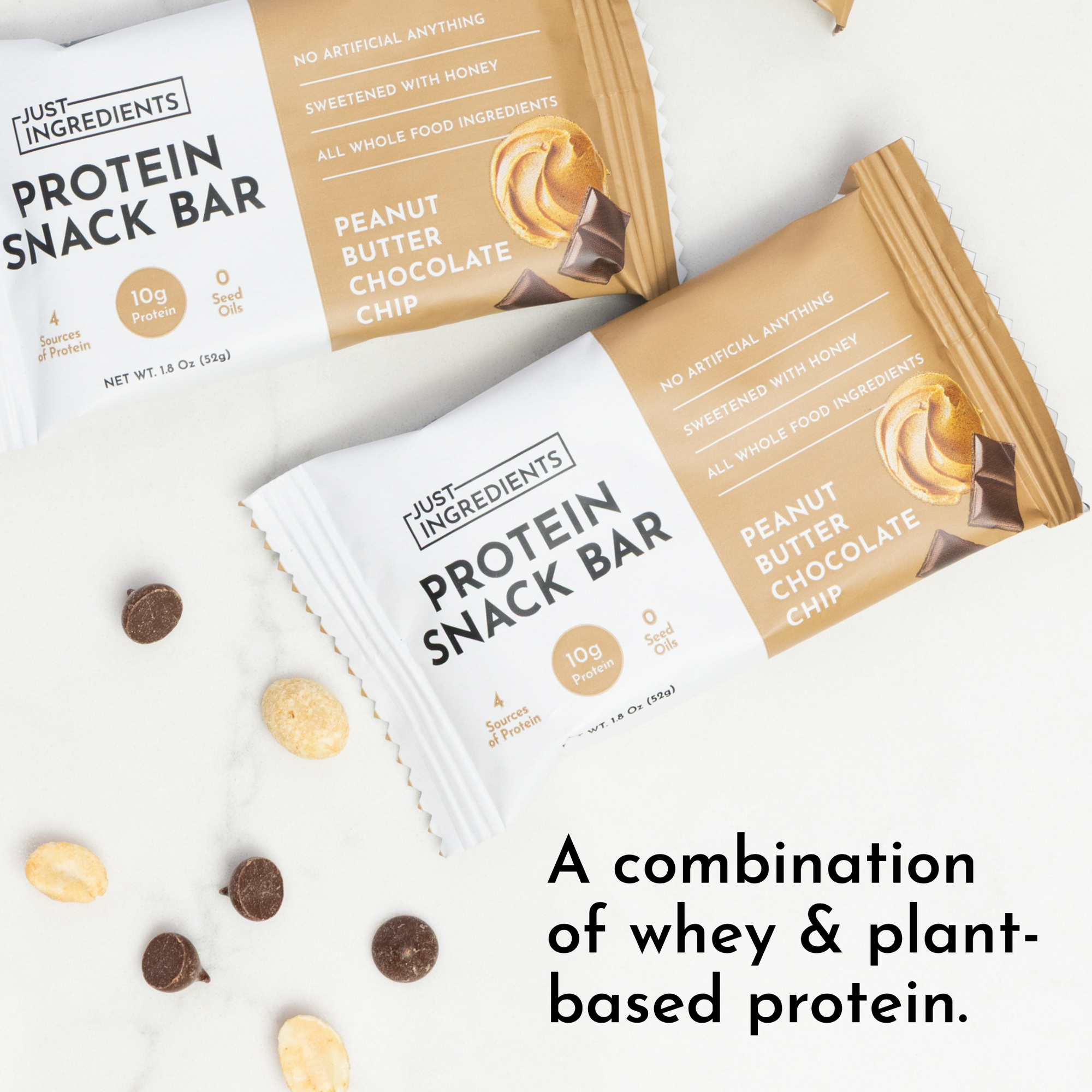 Two protein snack bars in packaging, with chocolate chips and peanuts scattered around.