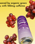A can of grape soda energy drink surrounded by grapes on a yellow background.