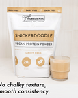 Vegan Snickerdoodle protein powder bag next to a glass of smooth protein shake.