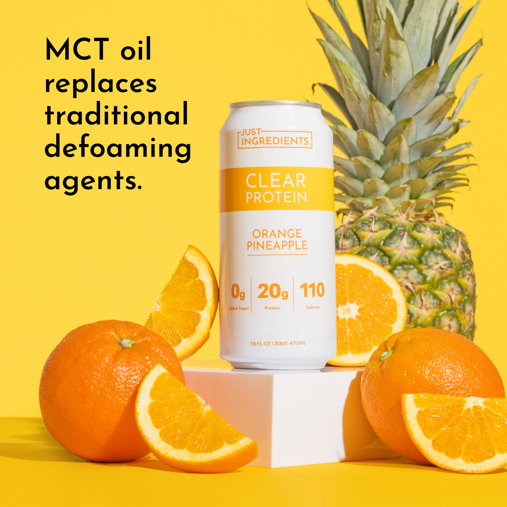 Clear protein drink can with orange and pineapple, surrounded by fresh oranges on a yellow background.