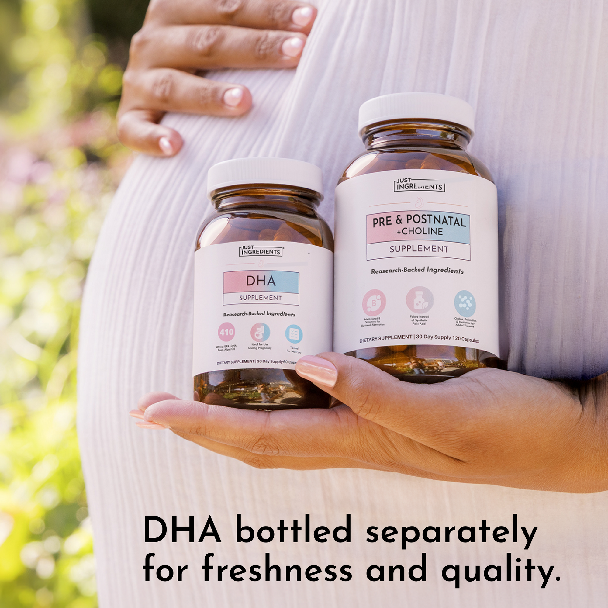 Two amber glass supplement bottles with white caps labeled DHA and Pre &amp; Postnatal + Choline held in hands.