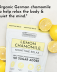 Pouch of Lemon Chamomile Nighttime Relax tea with whole lemons on a marble surface.