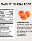 Three whole peaches next to supplement facts label for peach endurance drink with ingredients list.