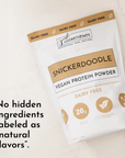 White pouch of Snickerdoodle vegan protein powder with gold accents and text highlighting its dairy-free and ingredient trans
