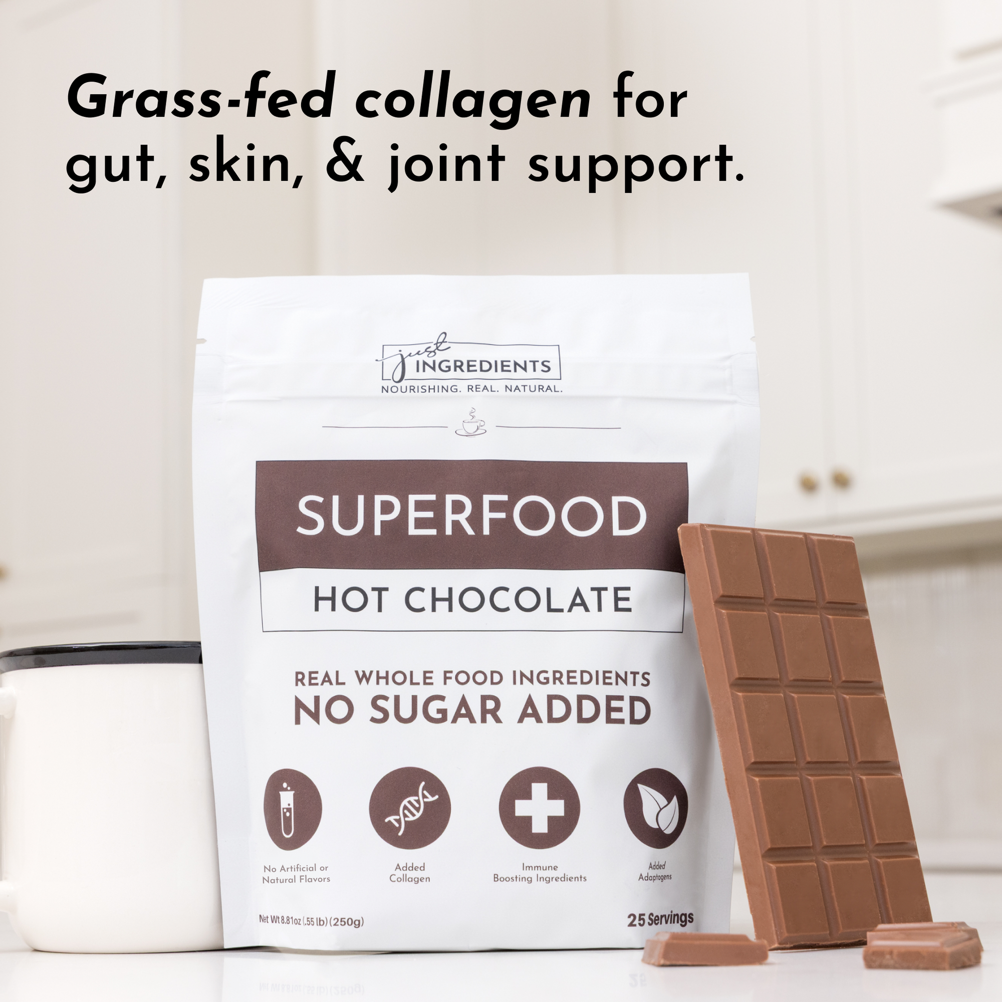 Packaging of Superfood Hot Chocolate with a chocolate bar and a white mug in a kitchen setting.