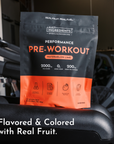 Black and orange pouch of Watermelon Lime pre-workout powder with nutrition information and ingredient icons on front.