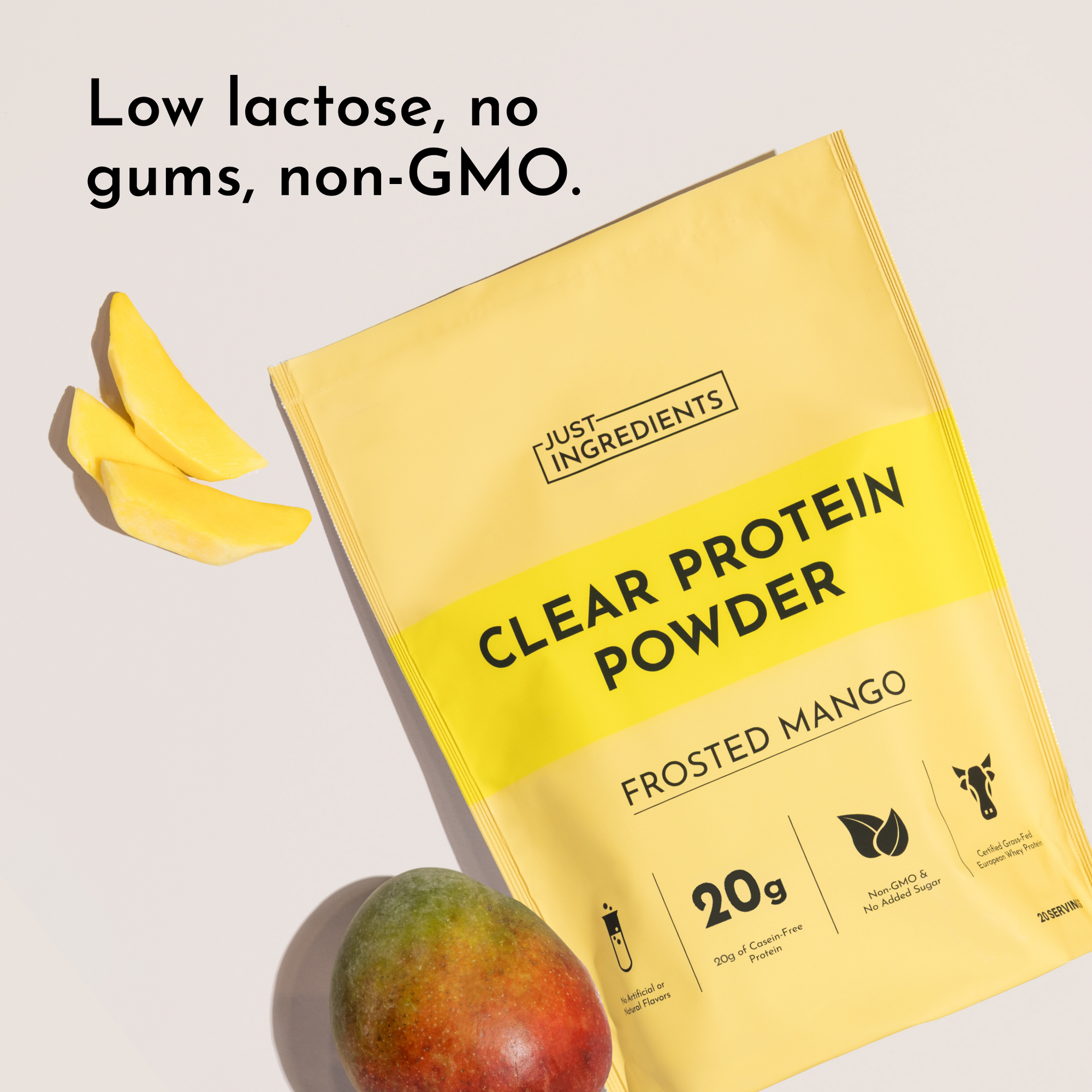 Yellow packet of Frosted Mango Clear Protein Powder with mango slices and whole mango displayed nearby.