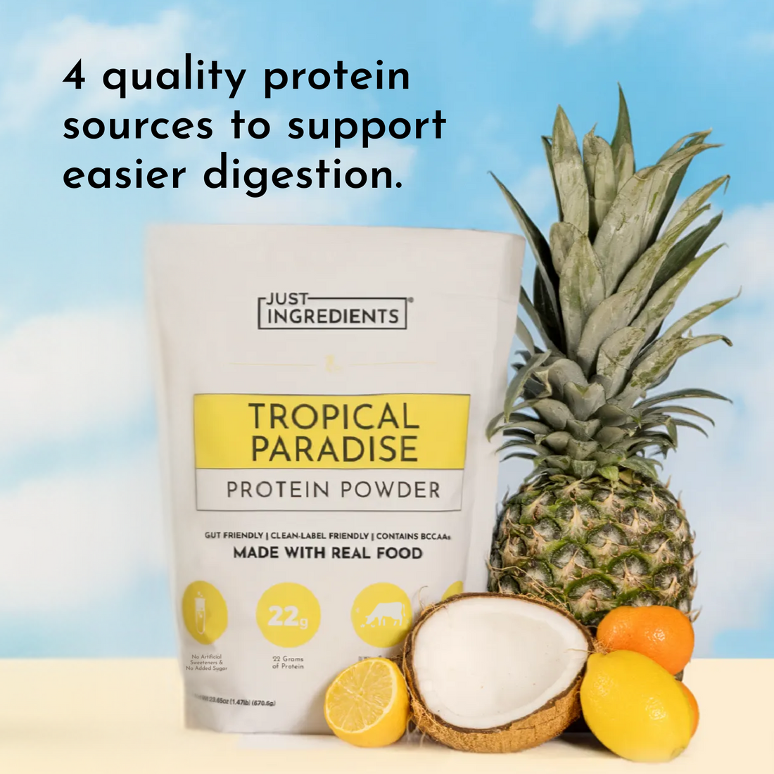 Protein powder pouch with pineapple, coconut half and lemons against blue-sky background