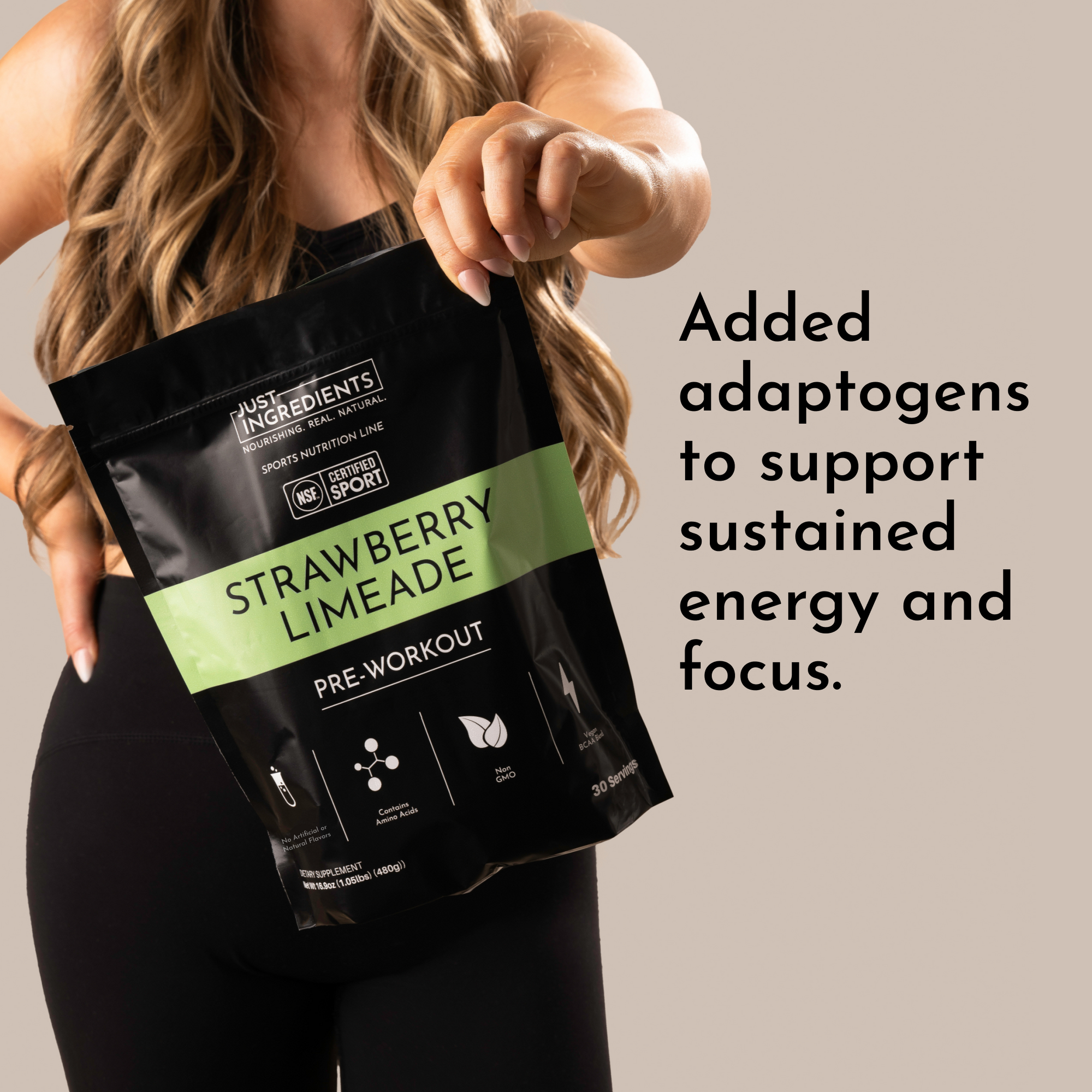 A woman holds a black pouch labeled "Strawberry Limeade Pre-Workout" with nutritional information visible.