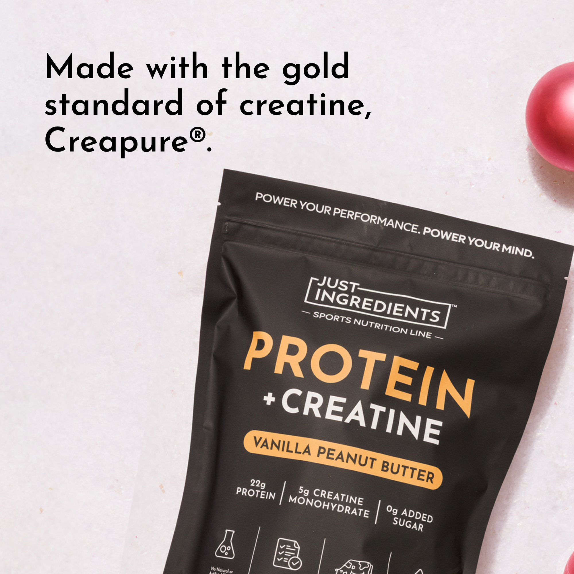Black packaging featuring "Protein + Creatine" in orange text, with details about protein and creatine content.
