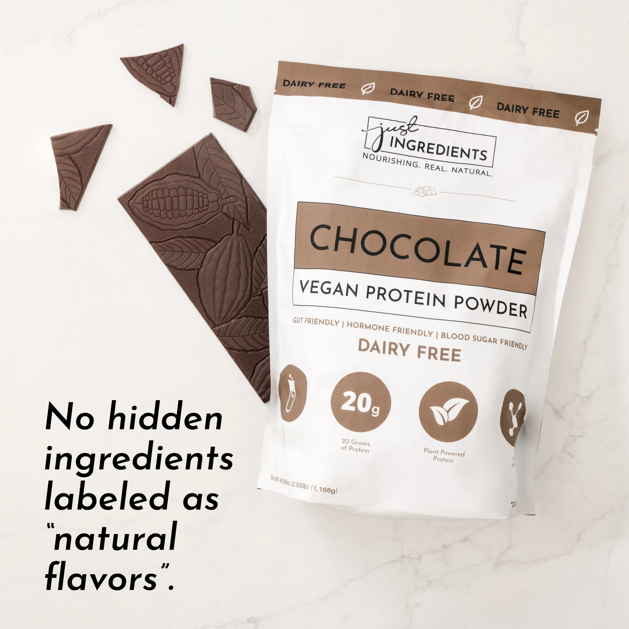 Brown bag of chocolate vegan protein powder with chocolate pieces on a marble surface.