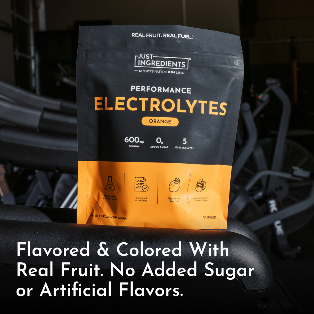 Orange-flavored electrolyte powder pouch with ingredient icons and nutrition highlights visible.