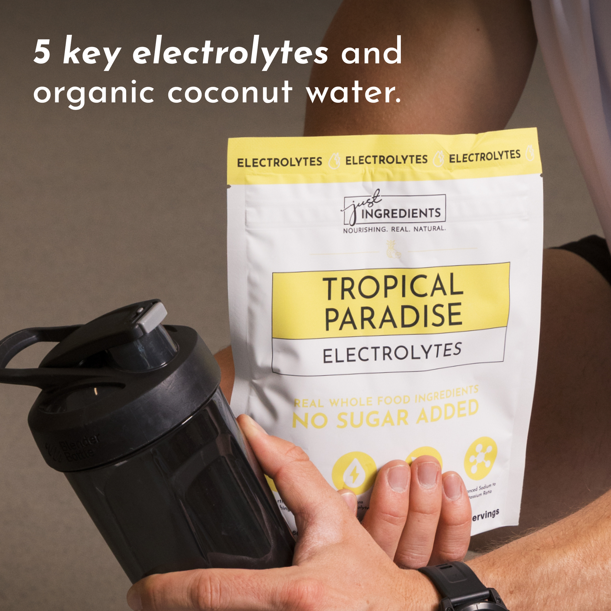 Pouch of Tropical Paradise Electrolytes with a shaker bottle, highlighting key ingredients and no sugar added.