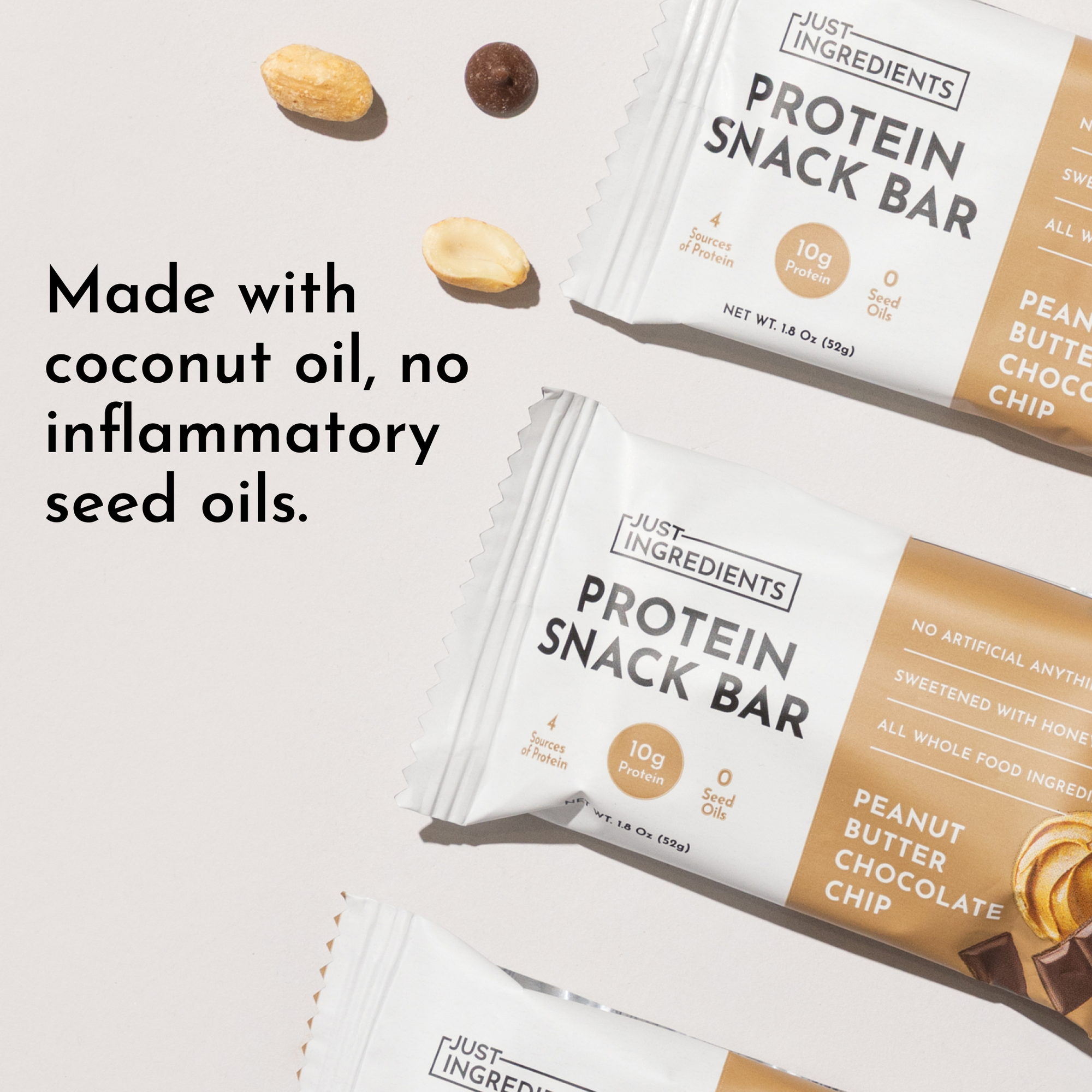 Two protein snack bars in packaging with peanut butter chocolate chip flavor, surrounded by nuts on a light background.