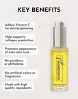 Brightening serum in a clear bottle with a silver pump, featuring yellow liquid and labeled benefits on a light background.
