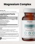 Amber glass bottle of Magnesium Complex supplement with white cap, label showing 60 capsules and supplement facts panel on le