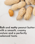 Peanuts in their shells with one unshelled peanut on a light surface.