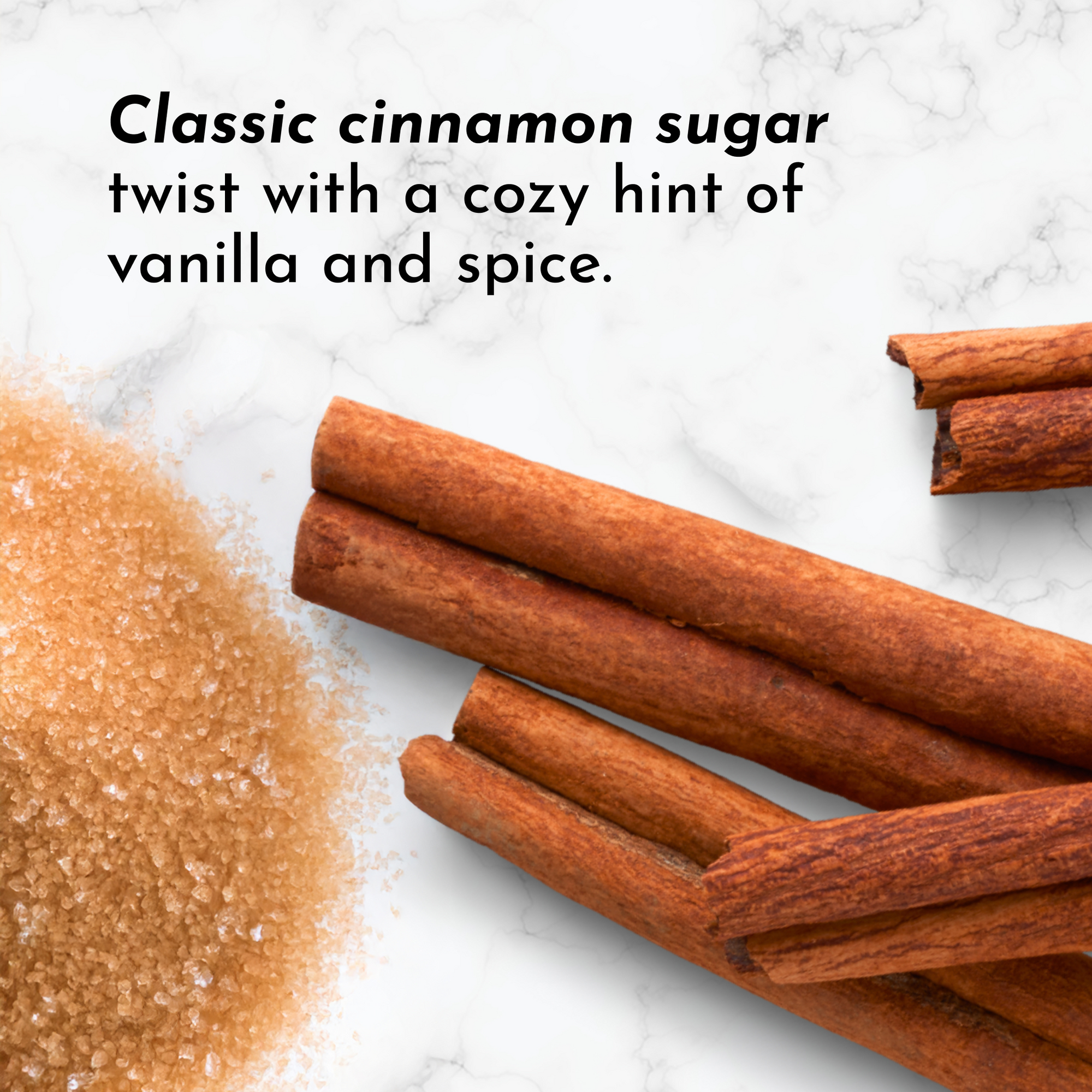 Cinnamon sticks and brown sugar on a marble surface.