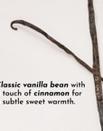 Vanilla bean pod with a curved end, lying on a light background, accompanied by text about its flavor profile.