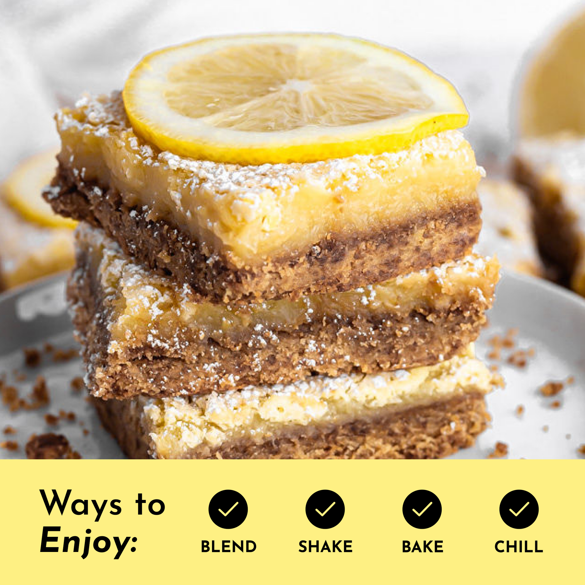 Stack of lemon bars topped with a lemon slice, dusted with powdered sugar on a plate.