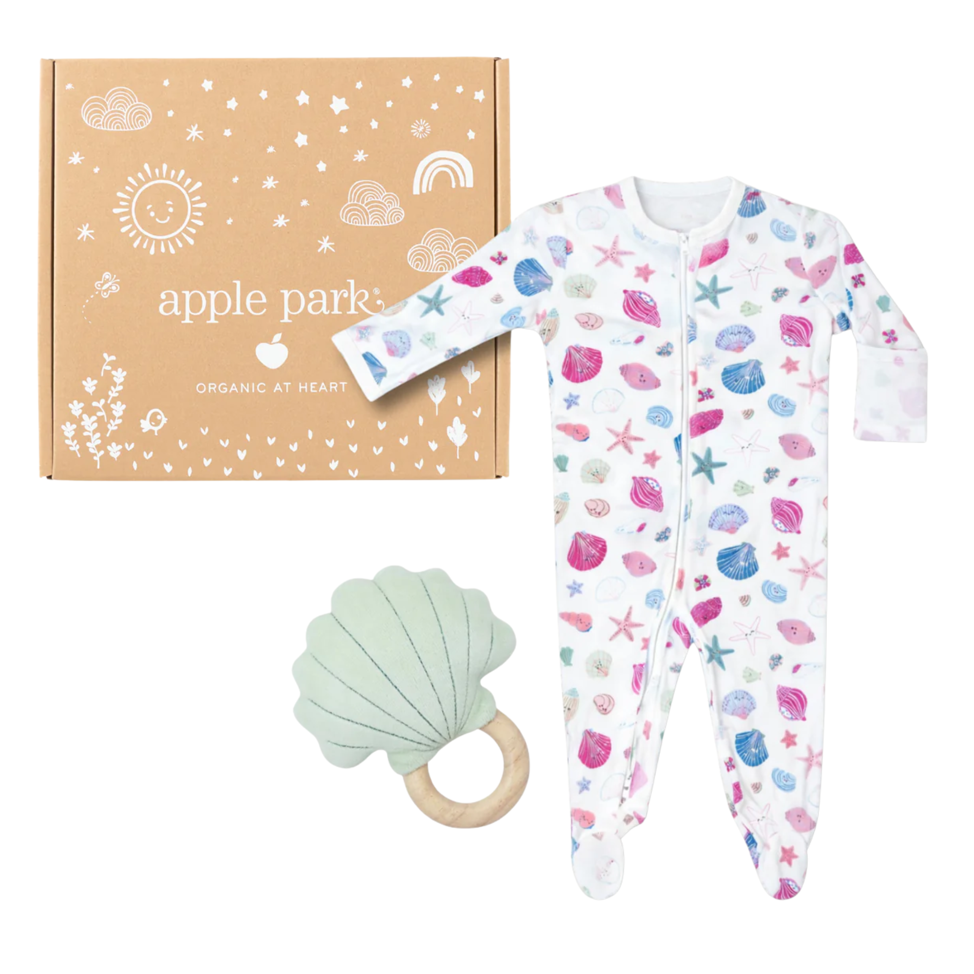 Organic cotton baby onesie with seashell print, a green shell-shaped teether, and a decorative box.