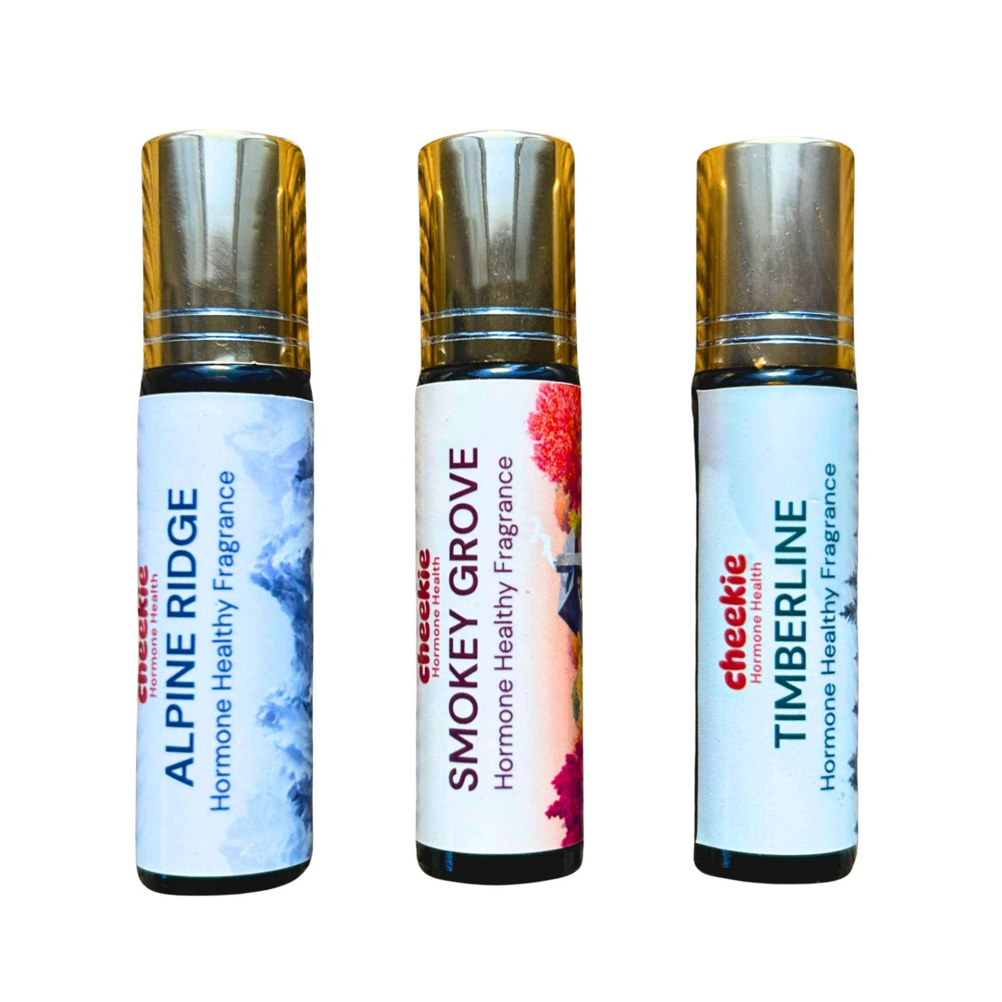 Three small roll-on fragrance bottles on a plain white background: Alpine Ridge, Smokey Grove, and Timberline by Checkie Organics. The bottles have metallic gold caps, black collars, and white labels with blue, red, and pink graphic accents.
