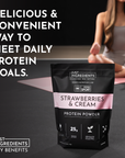 Black pouch of strawberries and cream protein powder with nutritional information, placed on a yoga mat.