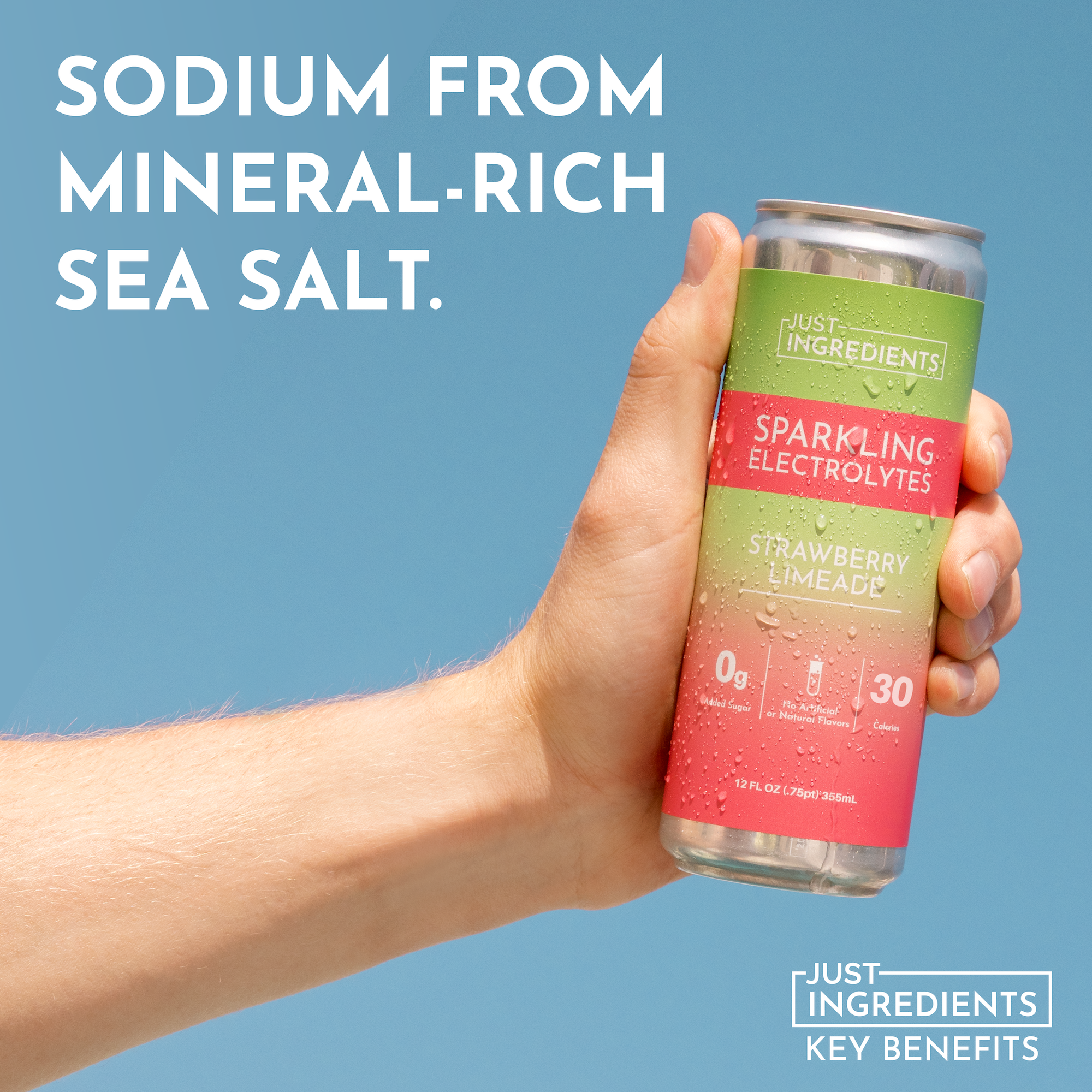 Hand holding a can of Strawberry Limeade Sparkling Electrolytes against a blue background.