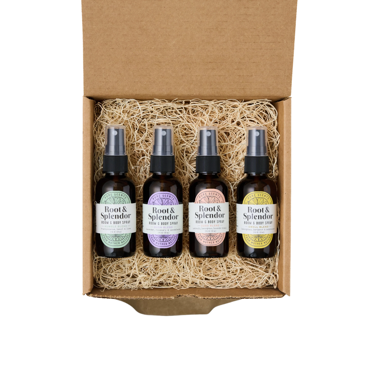 white background with cardboard box and 4 dark colored spray bottles