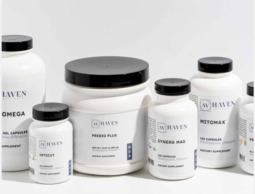 Assorted dietary supplement containers with black lids and white labels, featuring various product names and details.
