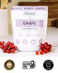 Colorful scoops of grape electrolyte powder on a pink background with a checkmark feature list.