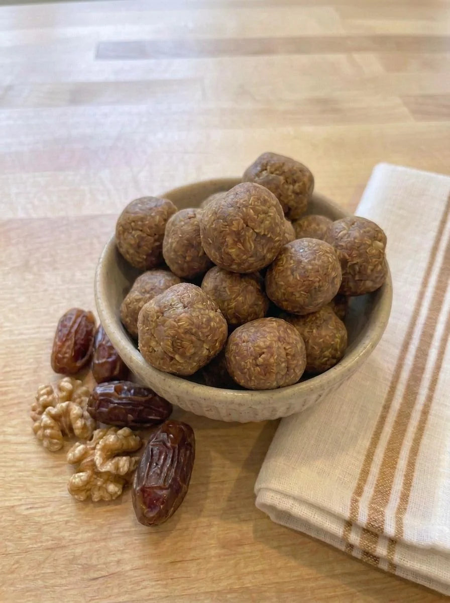Maple Pecan Pie Protein Bites in a bowl with dates and walnuts, made with Just Ingredients Maple Protein Powder