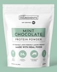 White pouch of mint chocolate protein powder with green accents and nutrition panel