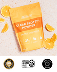 Clear orange creamsicle protein drink poured into a glass with the product pouch visible, highlighting 21g protein.
