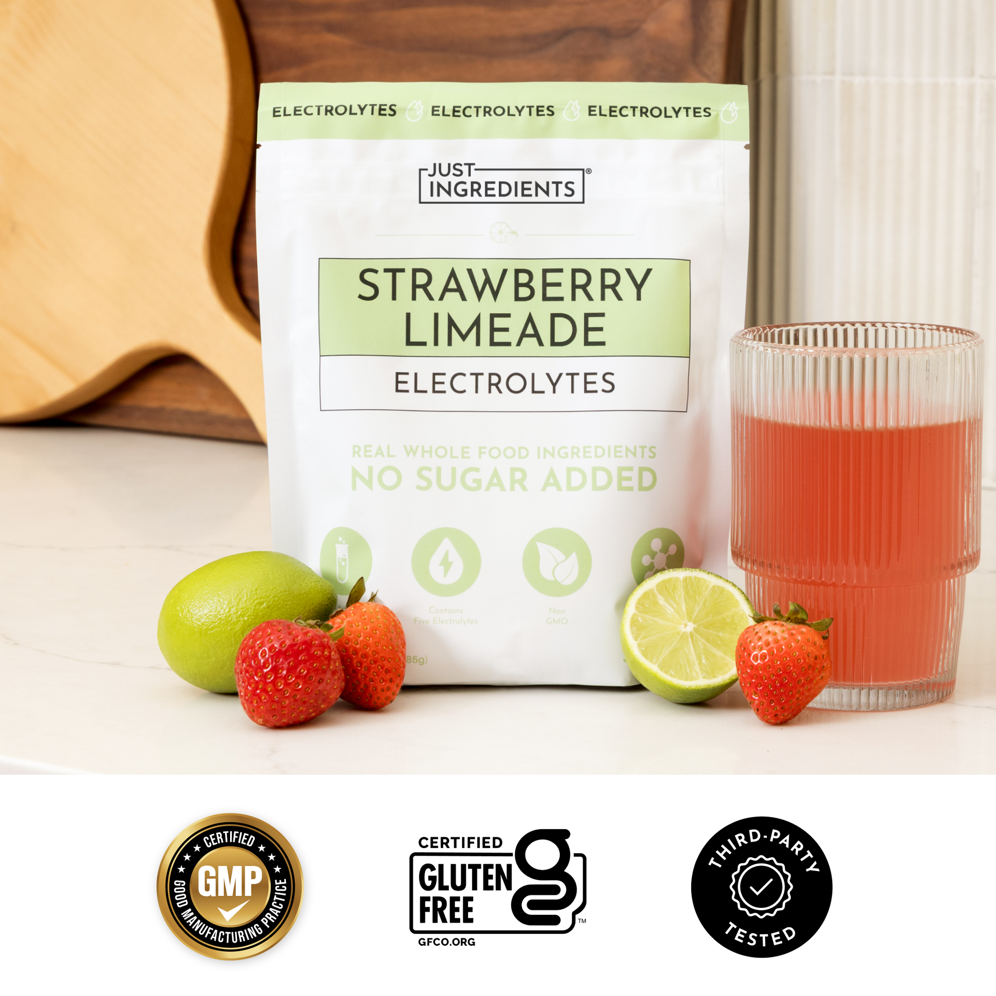 Checklist graphic showing benefits of Strawberry Limeade Electrolytes with colorful scoops on pink background.