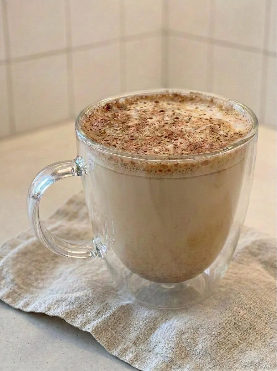 Spiced Maple Protein Steamer in a glass mug topped with cinnamon, made with Just Ingredients Maple Protein Powder