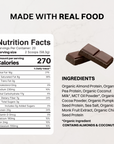 Brown-and-white bag of vegan chocolate protein powder next to chocolate bars, front label visible.