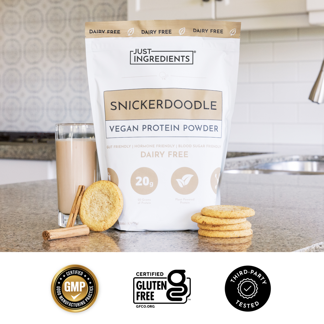 Hand holding a clear scoop of beige vegan protein powder above a glass smoothie, showing product features text.